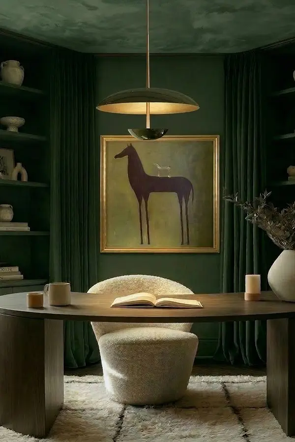Elegant green study with horse painting and boucle chair